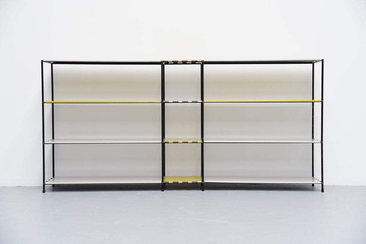 Very nice storage/shelving system designed by Poul Cadovius for Royal System, Denmark, 1960. This multifunctional system can be built by your own wishes; this is a very nice shaped long unit with rare metal shelves in grey and yellow. Very nice and