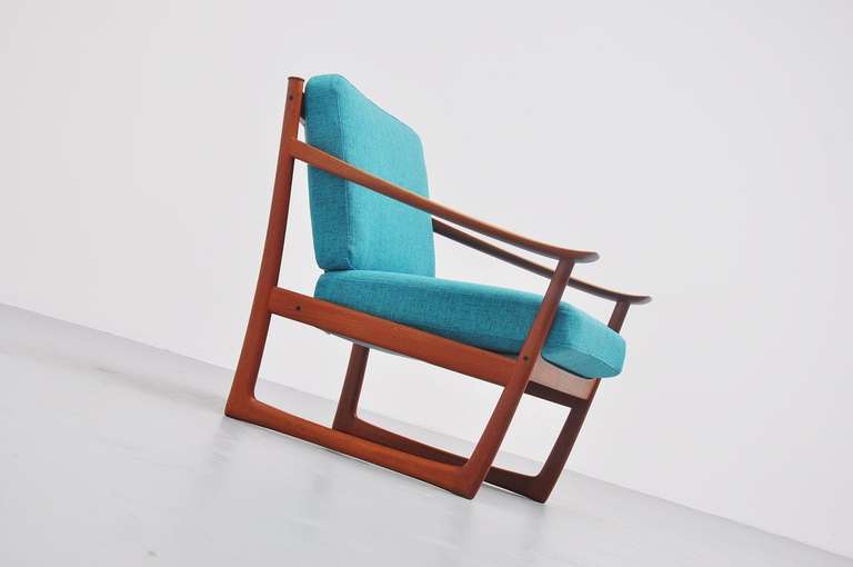 Very nice single lounge chair designed by Peter Hvidt and Orla Molgaard Nielsen for France & Son, Denmark 1961. This chair has a solid teak frame and is upholstered in bright blue fabric, the same color as the chair had. This is a very comfortable