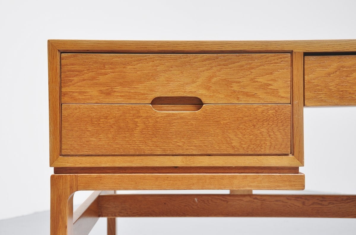 Medium sized desk designed by Arne Wahl Iversen for Vinde Mobelfabrik, Denmark 1965. This desk has 5 drawers and 4 with mirror faced handles and bookcases at the back. Very nice made and functional desk in perfect condition, fully restored with high