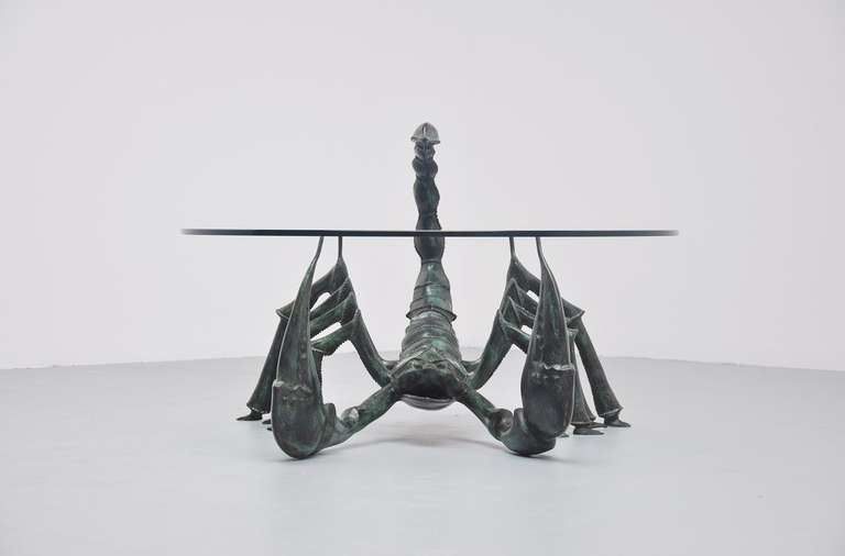 Very nice bronze crafted coffee table attributed to Jacques Duval-Brasseur, France 1970. This table in the shape of a scorpion was made of green patined bronze, is extremely heavy and has a thick hardend glass top. Super decorative table, a bit