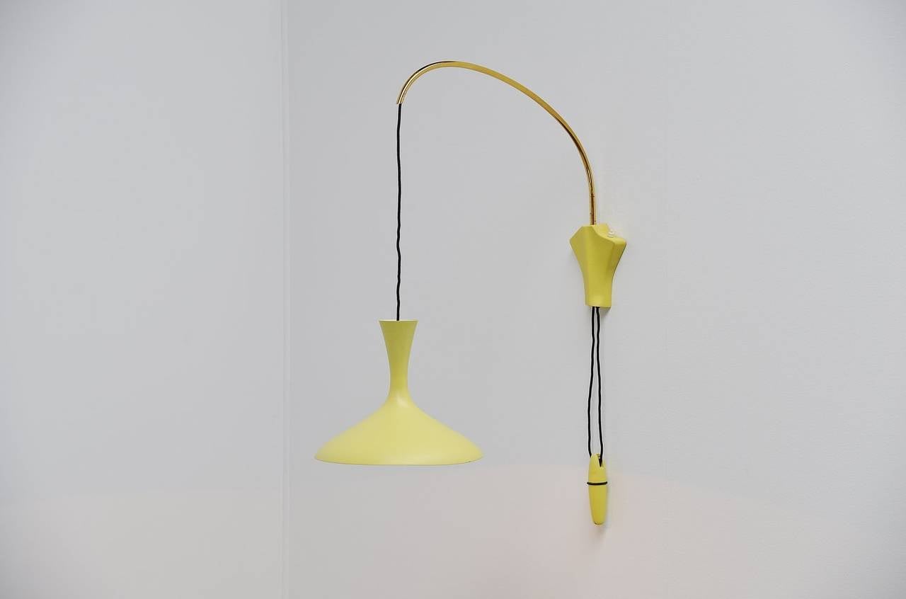 Amazing rare wall lamp by Cosack Leuchten, Germany, 1960. This lamp, or similar models are often misattributed to Philips or Stilnovo. Where in fact these were made in Germany by Cosack. Very nice organic shaped wall lamp with typical 1960s yellow