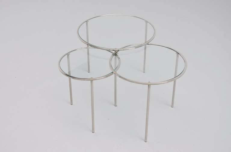 Very nice tubular nesting table set, modernist forms made in Holland, 1950s. This Bauhaus style nesting table set was made of chrome tubular frames and have glass top. In the manner of Marcel Breuer and Mies van der Rohe. Very nice shaped set, all