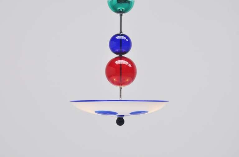 Amazing chandelier by Simone Cenedese for Cenedese, Italy, 1980. These fantastic chandeliers (four available) are made of very thick blown glass, all are a little different, and give very nice light when lit. They have primary colors as green, red