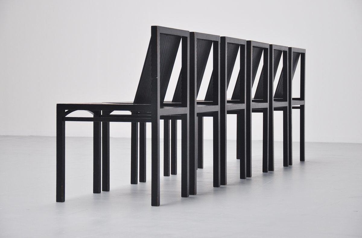 Very nice set of 6 dining chairs designed by Ruud Jan Kokke for Harvink, Holland 1984. These chairs are made of black lacquered birch wooden slats, glued and joint without screws or nails. The chairs have a wonderful patina from age and usage to