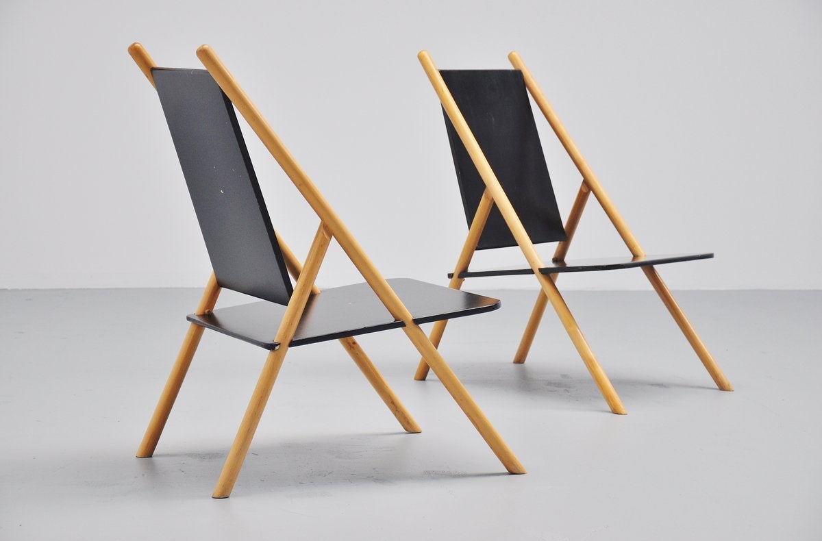 Very nice pair of modernist lounge chairs designed by Yrjo Wilherheimo and Rudi Merz for Korkeakosko, Finland 1970. These chairs have birch wooden frames and black lacquered seats and backs. The chairs are in original condition and have an amazing