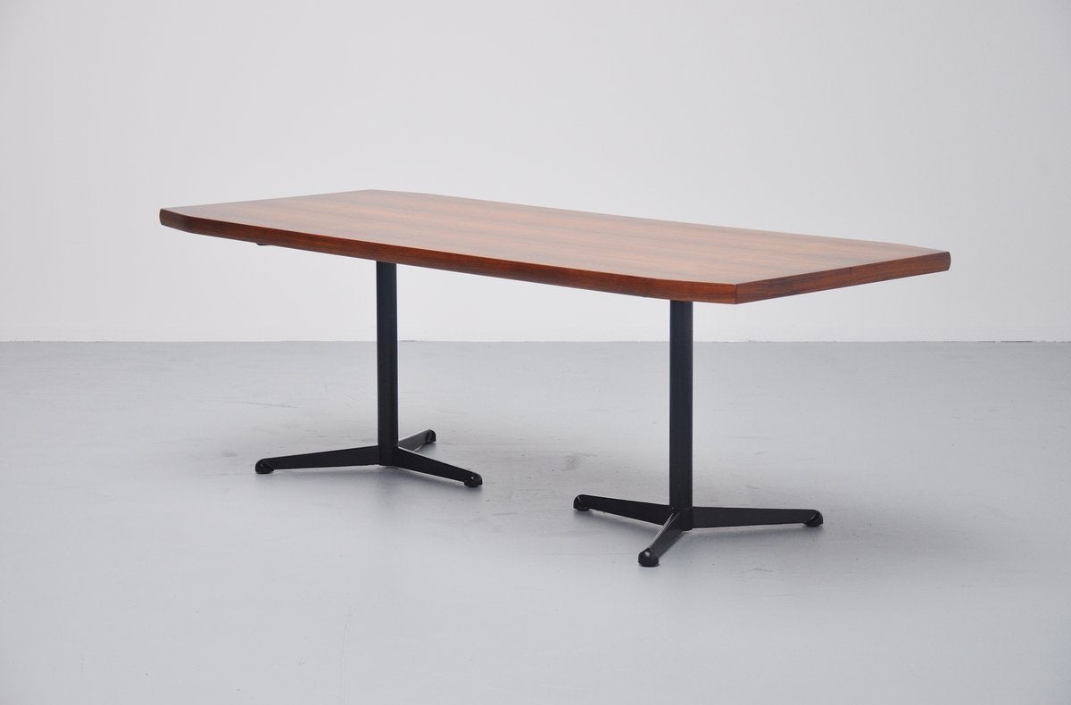 Very nice 1st edition of this writing table / desk designed by Osvaldo Borsani for Tecno, Italy 1954. This table has black lacquered tripod feet which is a great contrast with the walnut top. Heavy table top and solid leggs, quailty all over. The