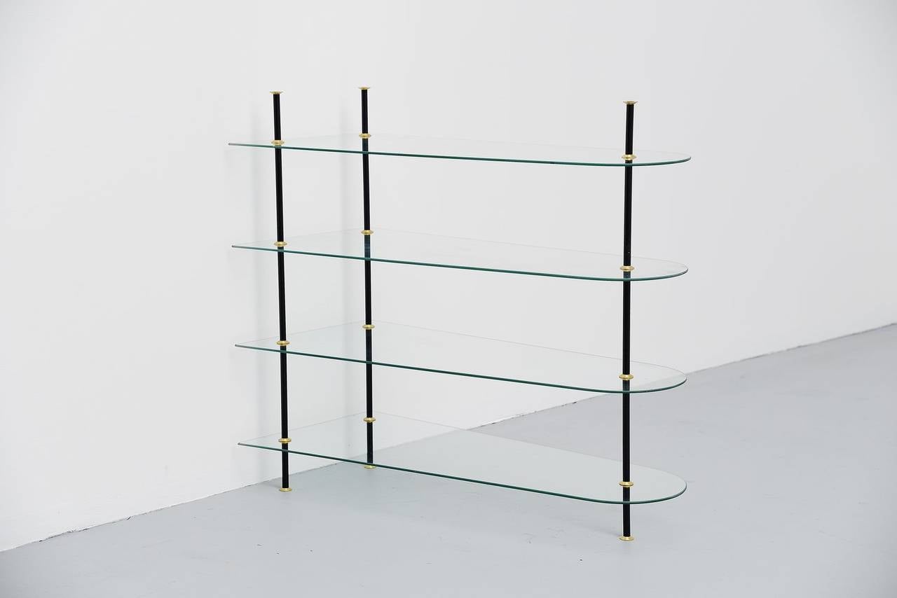 Very nice group of 7 glass and metal etageres made in Italy 1950. These very nice modular etagere units can be built to your own wishes and combinations. They all have different shapes of glass and sizes but the complete set looks very nice. Easy to