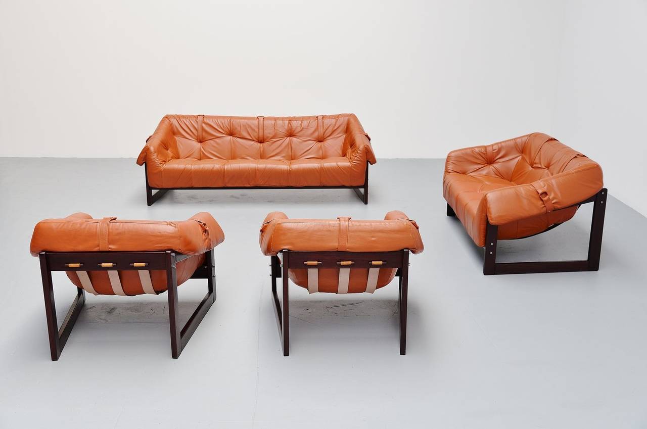 Very nice and large lounge sofa set designed and made by Percival Lafer, Brazil 1960. This sofa has a solid rosewood frame, and the cognac leather cushions rest in rubber straps. The sofa set is in excellent condition. This is for a three-seater