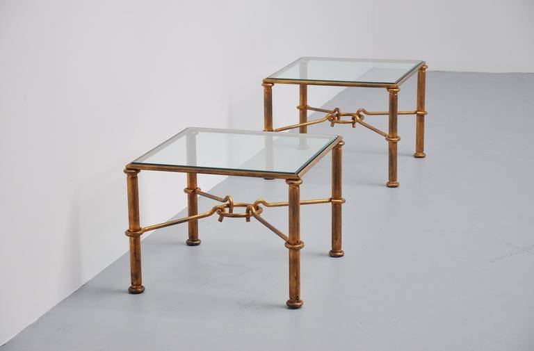 French Gilt Iron coffee tables in style of Rene Drouet. Gold painted gilt metal tables. In the manner of Rene Drouet. Very nice sculptural coffee tables with facet cut glass tops. In very good condition, original.

Please contact us for affordable