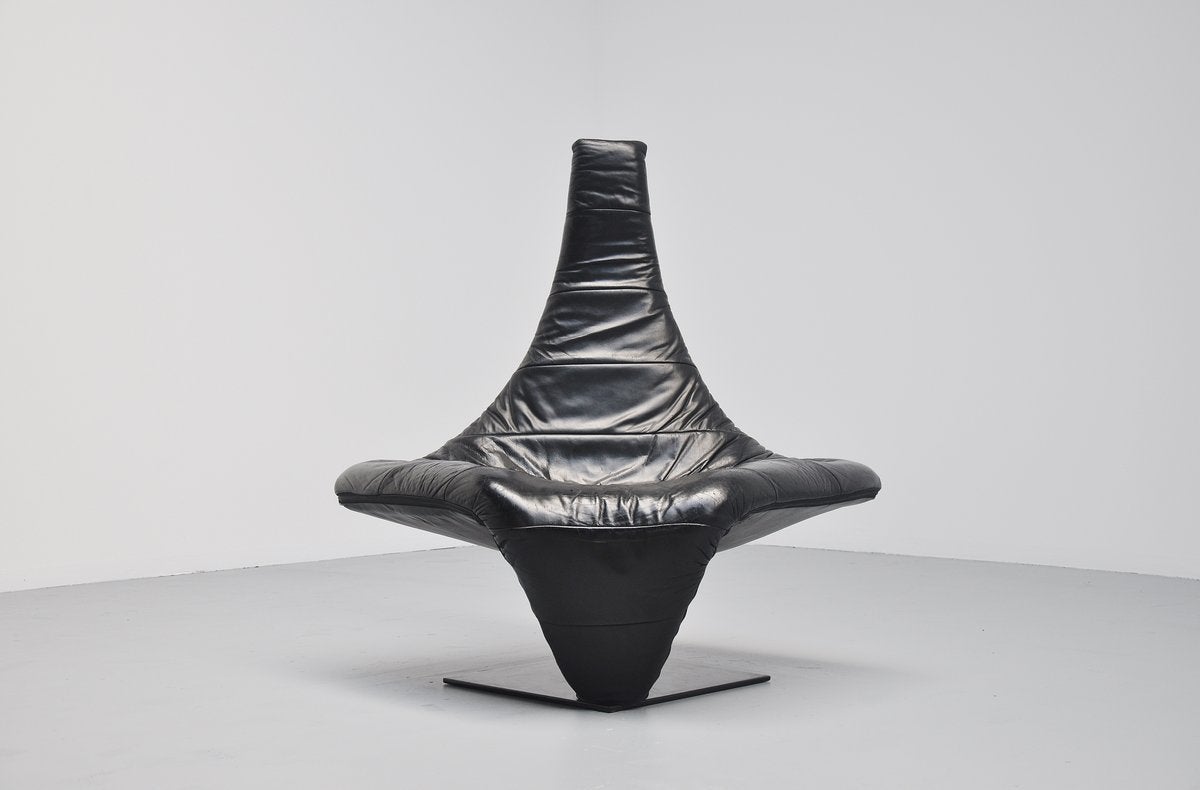 Very nice shaped and super comfortable chair designed by Jack Crebolder for Harvink, Holland 1982. This chair is fully covered in black leather, it has a metal frame covered with foam and fabric for super comfortable seating. There are only 200