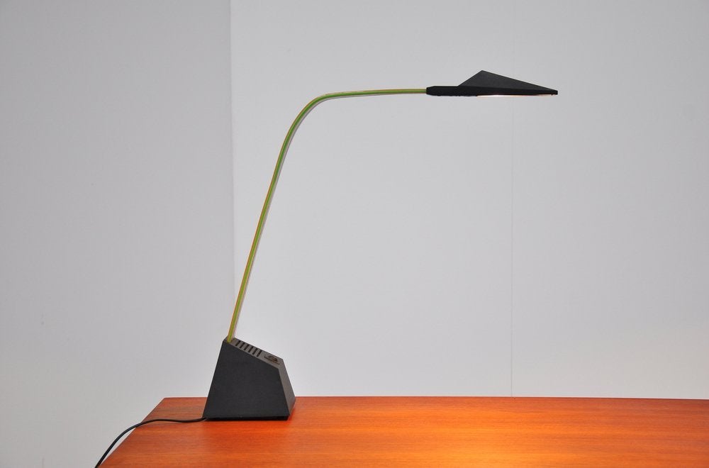 Rare halogen desk lamp designed by Alberto Frasier for Stilnovo, Italy 1983. This multi colored table lamp is type Nastro and has a halogen light bulb. The lamp can be switched in 2 light positions and works perfectly. These halogen lamps are still