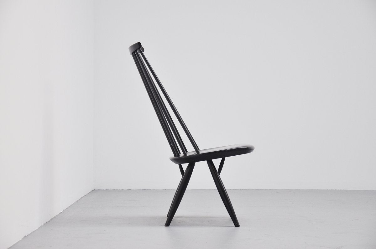 Very nice 'mademoiselle' low lounge chair designed by Ilmari Tapiovaara for Asko, Finland, 1956. This lounge chair was made of black lacquered wood, comes from first owner and is in very good original condition. This chair would look great in any