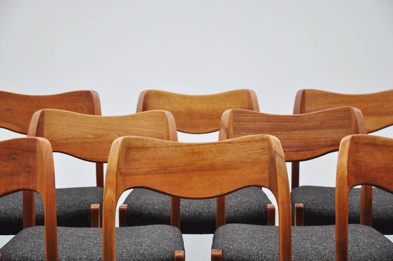 Very nice large set of 12 dining chairs designed by Niels Møller for J.L. Møller, Denmark, 1951. These chairs are made of solid walnut wood which is quite rare; they have very nice dark grey or black upholstery in whool. Newly upholstered and can be