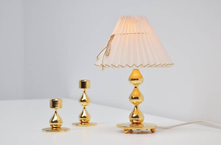 Very nice sculptural candlestick and lamp set designed by Hugo Asmussen for Asmussen, Denmark 1960. Very nice set, heavy made and in superb quality. In perfect condition and all marked accordingly. Measurements are for the lamp, includes
