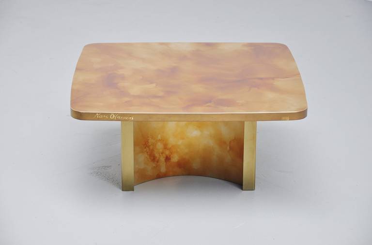 Very nice and spectacular looking cocktail table designed and crafted by Marc D'Haenens, Belgium 1978. This is a unique one or off table and one of the last tables he made. The top is made of patined brass with resin finished top. Made in the manner