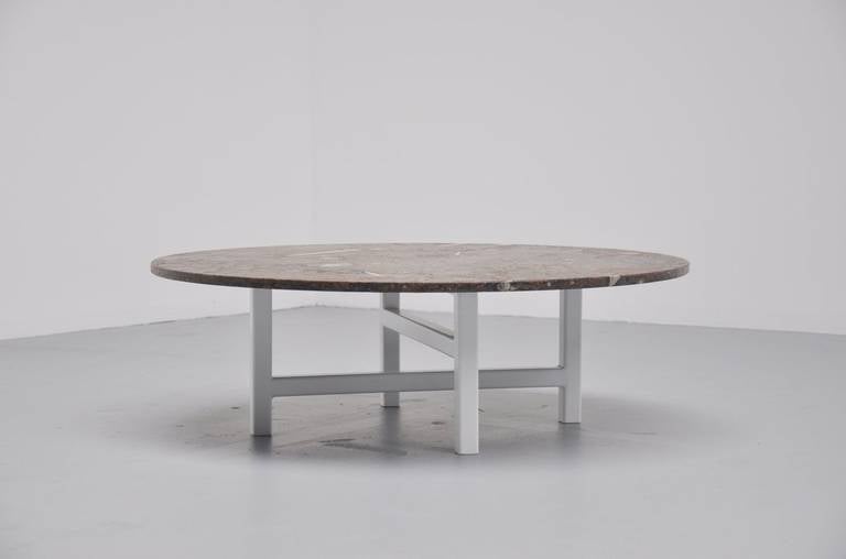 Very nice one-off coffee table made by Heinz Lilienthal, Germany, 1970. This table has a spectacular sculptural fossil stone top, in very nice brown grey color, full of fossils. It has a very nice white metal base heavy and beautifully made table.