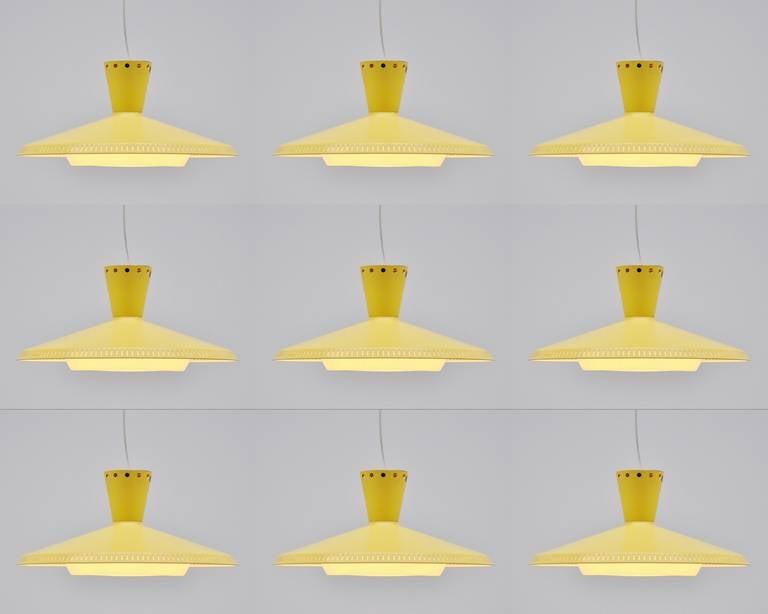 This very nice ceiling fixture is model NB92 designed by Louis Christiaan Kalff for Philips, Holland, 1959. It has a bright yellow lacquered shade and original plastic diffuser. Nice pendant lamp can also be used as ceiling lamp. Nice set of nine