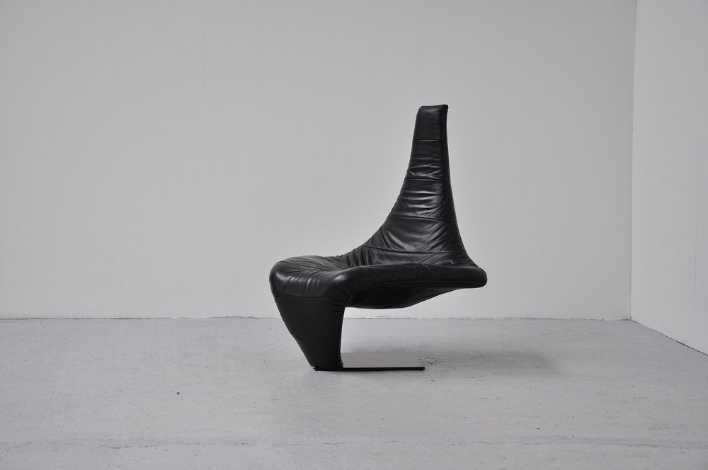 Very nice shaped and super comfort chair designed by Jack Crebolder for Harvink, Holland 1982. This chair is fully covered in black leather, it has a metal frame covered with foam for super comfortable seating. There are only 200 chairs made of each