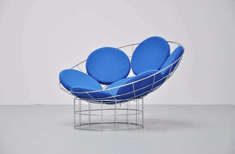 Fantastic peacock chair by Panton with bright blue fabric, like Panton used for a lot of his chairs. Super comfort seating and nice forms. Wire metal frame in good condition. Pillows can be upholstered in any wanted color.