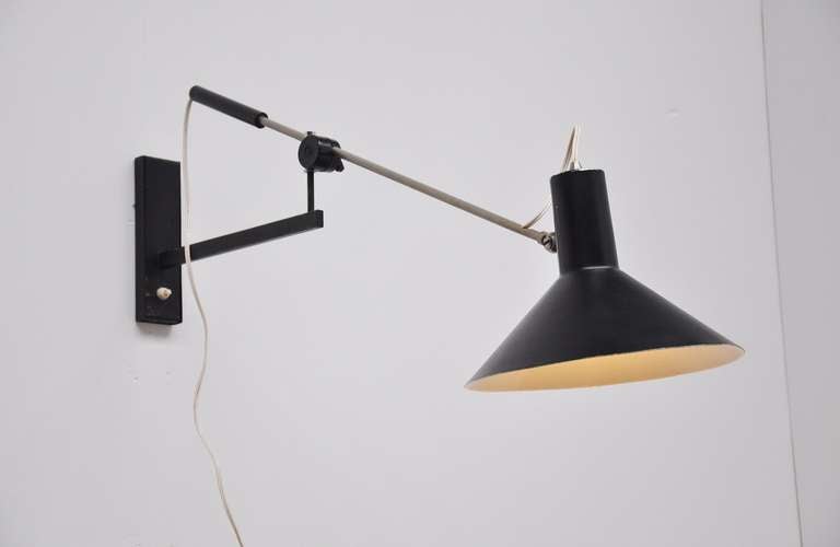 Very nice adjustable wall lamp with counter balance weight and articulating arm designed by JJM Hoogervorst for Anvia Almelo. Adjustable in numerous positions, easy to wall hang and fully functional. Original condition.