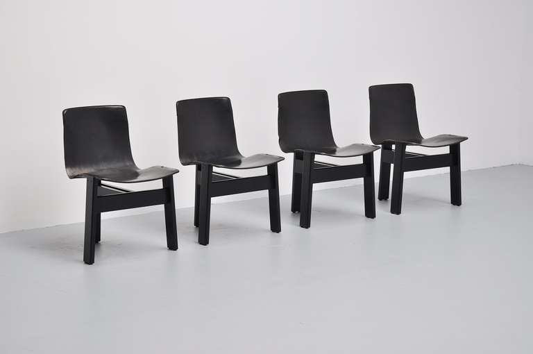 Very nice Italian dining chairs completely in black. Leather has very nice patina from usage but no tears.