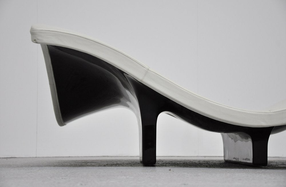 Beautiful sculptural wave sofa designed by architects Anne-Mette Jensen and Morten Ernst for Erik Jorgensen furniture in 1994. They won a price with the design of this sofa. It has a moulded fiberglass foot and high quality durable white leather.