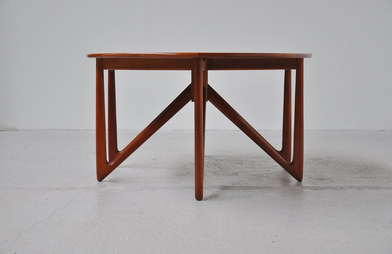 Amazing sculptural drop leaf table designed by Kurt Ostervig for Jason, Denmark 1960. This table is in amazing condition ans has super details. This is a very stable example of a folding table and marked on the bottom. Amazing original condition.