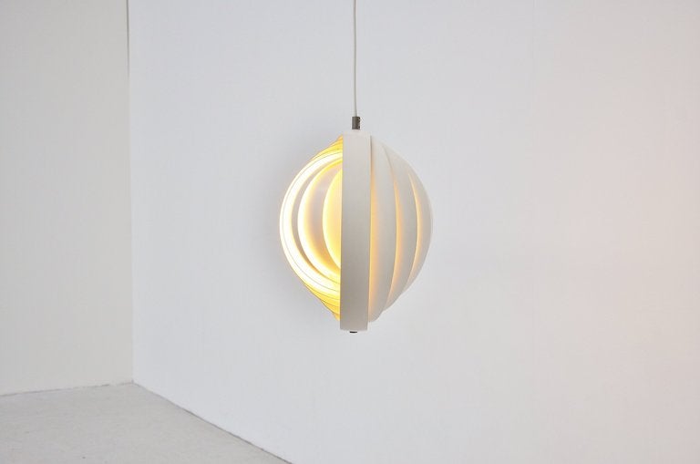 Rare early edition of the famous Verner Panton moon lamp, designed for Louis Poulsen, Denmark 1960. This lamp was made of multi layer white lacquered metal and gives amazing warm light when lit. Lamp is in fantastic all original condition.