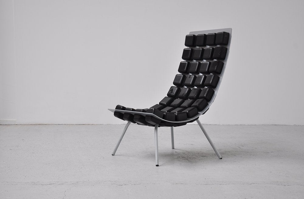 Rare easy chair designed by Kombinat; Sven-Anwar Bibi, Mark Gutjahr und Jörg Zimmermann in 2001. Chair was made of a curved aluminum shell which is punctuated with approximately fist-sized cubes made of Bayflex which are soft and very comforable.