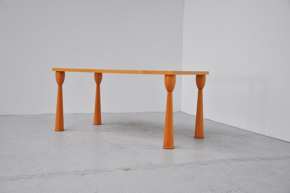 Rare dining table designed by Ettore Sottsass for Zanotta Associati. This limited edition tabled exhists in diffrent varietys of tops and models of shape. The table is in very good original condition and is a good future investment.