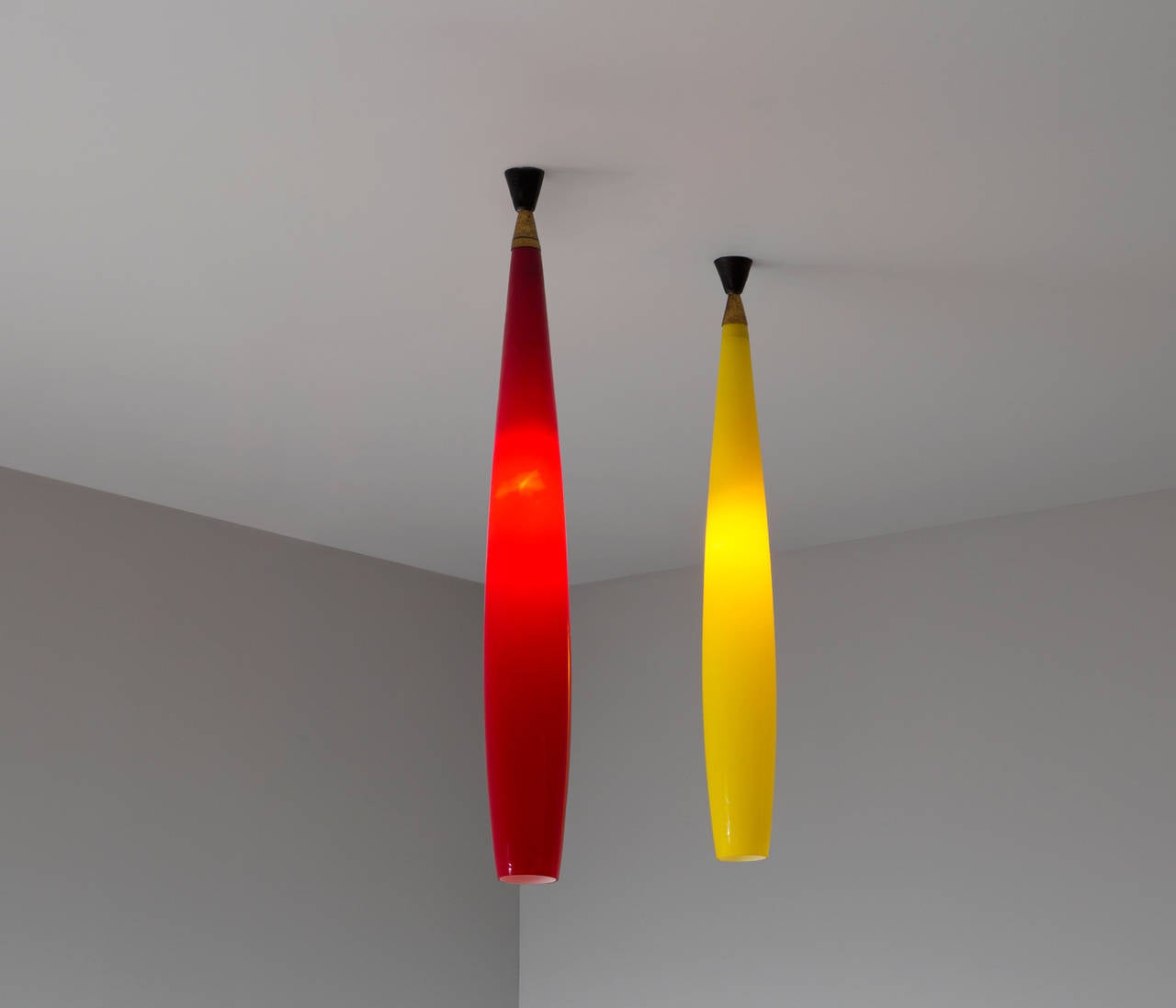 Pair of two very long - 40 inch pendants by Alessandro Pianon for Vistosi Murano.

Stunning pair of blown glass pendants designed by Alessandro Pianon for Vistosi Murano in 1960 with beautiful brass details. These pendants creates a beautiful