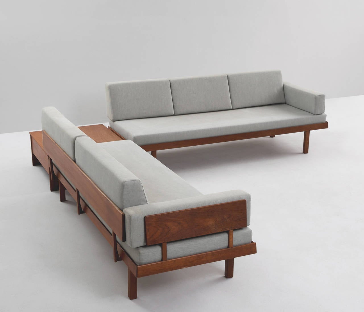 Living room set, in teak and fabric, Denmark, 1960s.

Well designed sofas from Danish manufacture. The frames are completely been made of solid teak. Due to the elegant slim legs and open expression from the backrests these sofas could fit any