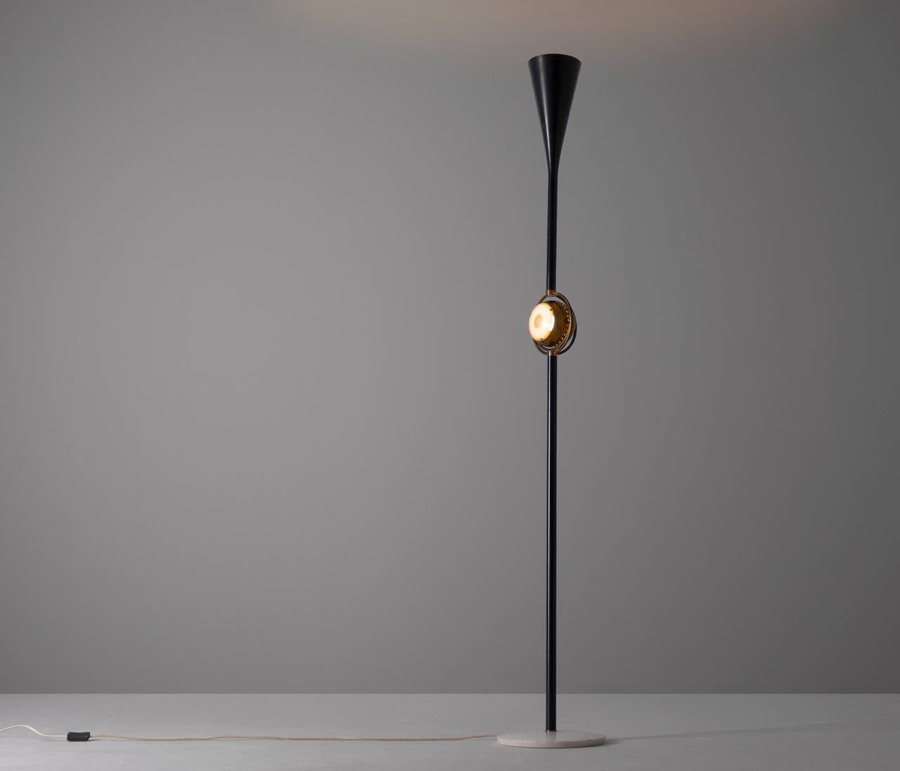 Angelo Lelli 'Eye' floor lamp for Arredoluce.

A very well sculptural designed floor lamp that features a pivoting brass eyeball in the center of the stem. 

This rare floor lamp is designed by Angelo Lelli for Arredoluce in the 1960's and