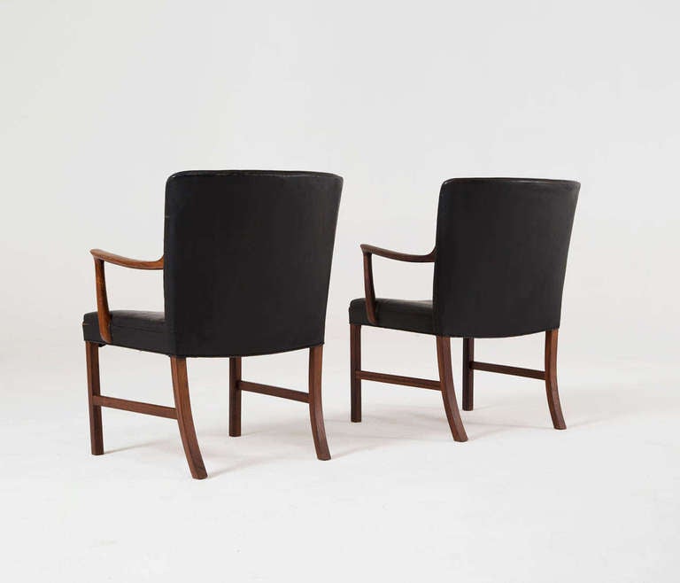 Very exclusive club chairs/armchairs by Ole Wanscher, produced by master cabinetmaker A. J. Iversen. 

These chairs, hardly never found in this version as low armchairs, the large version, are in a superb condition. The carvings and connections in