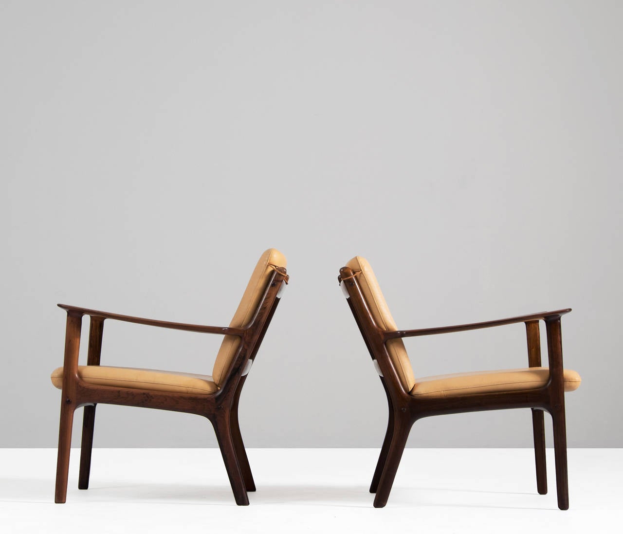 Wonderful pair of lounge chairs by Ole Wanscher, Denmark, 1960s.

This pair of chairs is made of solid rosewood and upholstered in high quality natural leather. Excellent finish or grain of the wood and great wood joints. Open design with a very