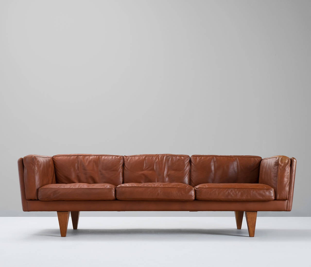 One of the best Danish designed sofas. Very high comfort due to the down filling of the cushions which give it a rough look. Combined with the very smart designed outside, it gives a wonderful combination. The form and positioning of the legs and