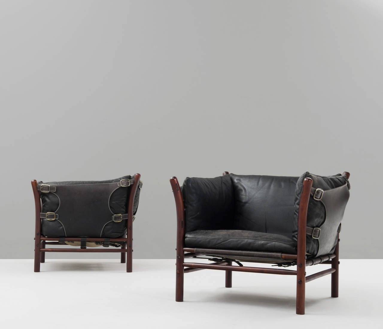 Set of two 'Ilona' lounge chairs, in rosewood and leather, by Arne Norell, Sweden, 1960s. 

Very nice contrasting pair of easy chairs by Arne Norell. The pair is designed with very thick and rich leather which shows a certain luxury for that