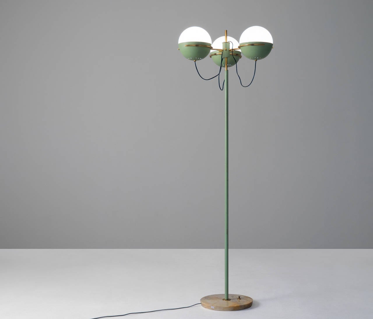 Floor Lamp by Stilnovo with Brass Details

Elegant standing floor lamp by Stilnovo, Milan, Italy.
The mint green shades goes very well with the brass and white globes. 

The base is in marble, and finished with stunning brass details.
We do