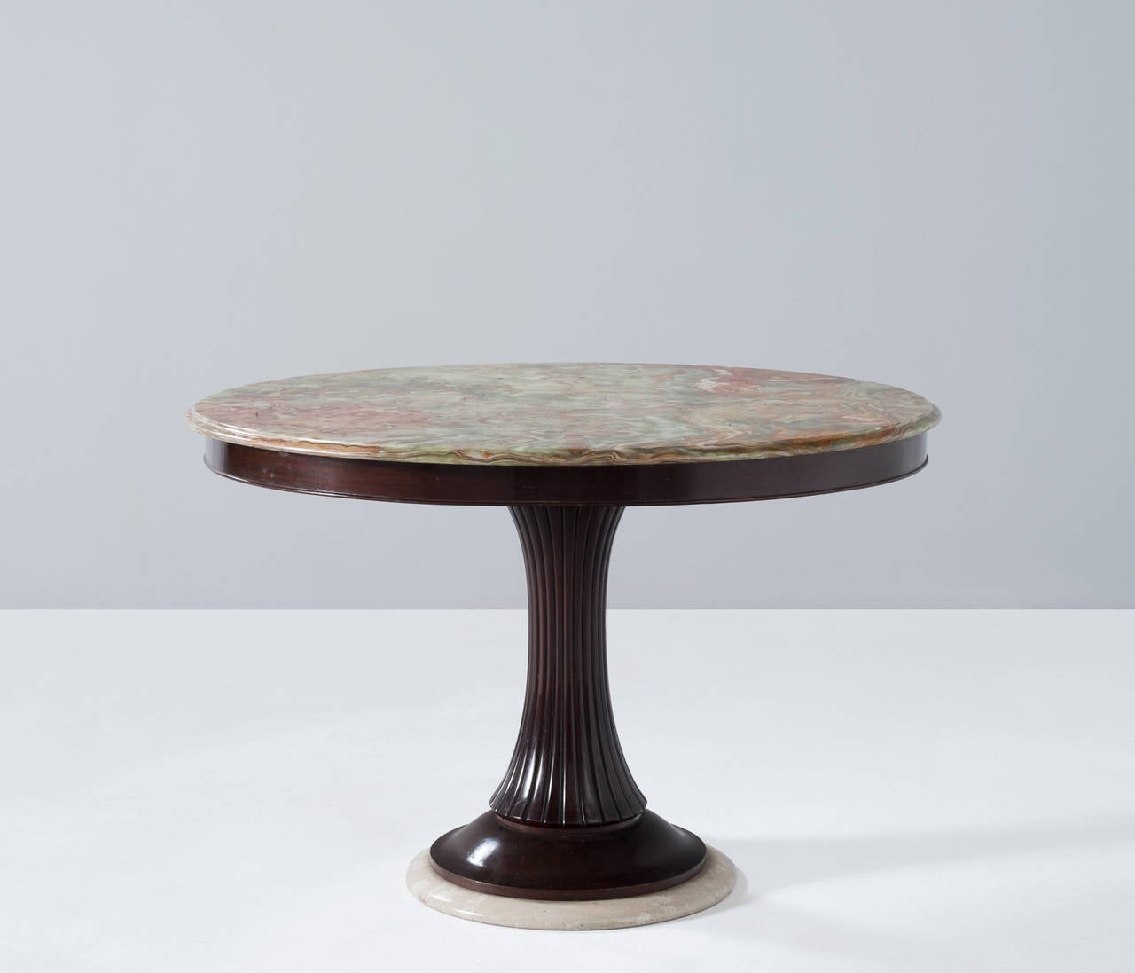 Center table, in wood and marble, by Osvaldo Borsani for Arredamento Borsani, Italy 1950s. 

A very nice dining table by Osvaldo Borsani for Arredamento Borsani. This distinctive center table was made circa in the 1950s and holds a wooden shaft and