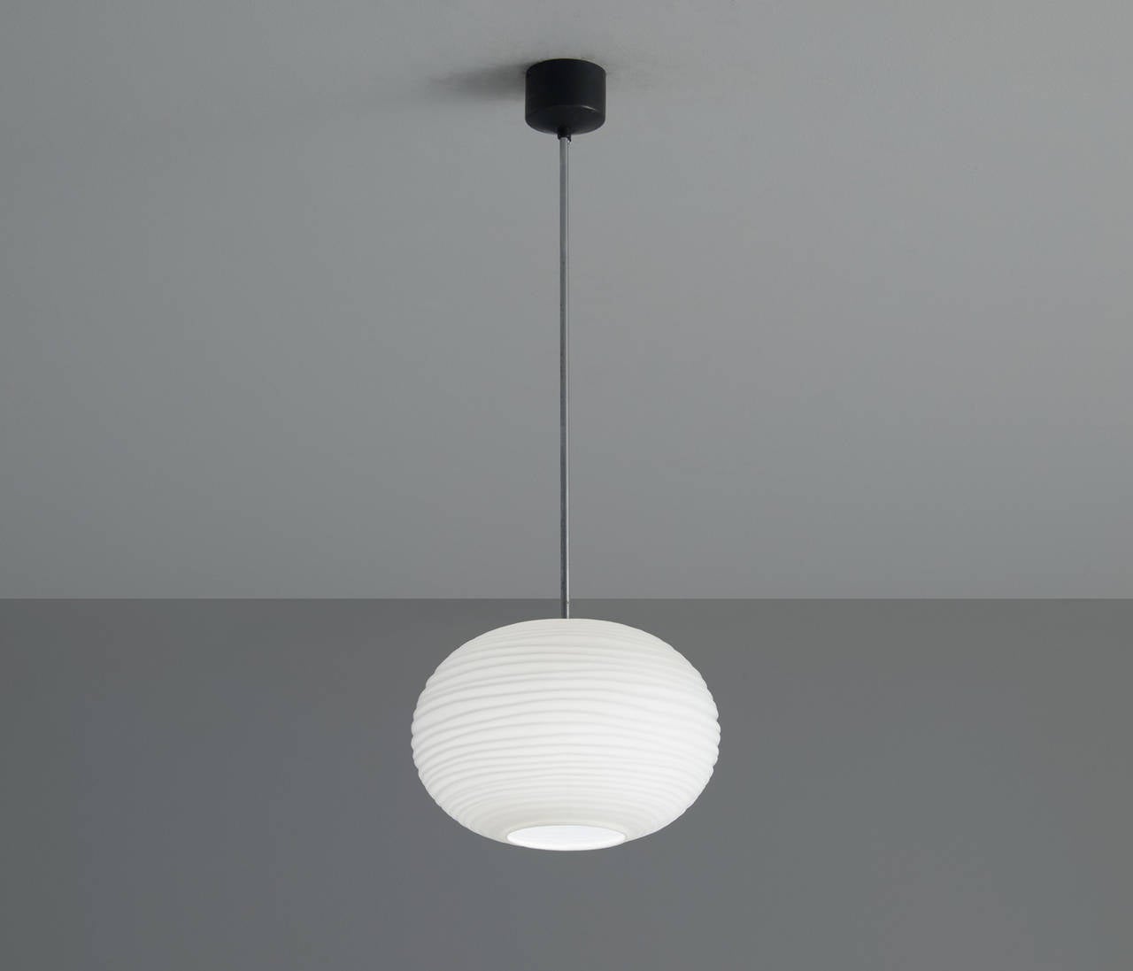 Very elegant ceiling lamp with large matte white opaline shade. 

These bulb-shaped spheres have a very elegant and soft light partition. The organically rippled surface of the spheres is remarkably well made and features very special details. The