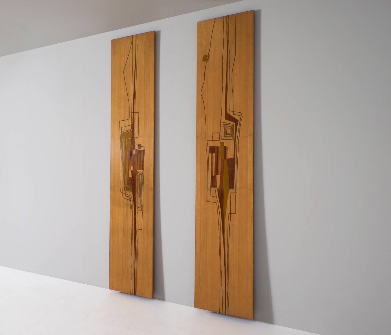 Two decorative wall panels by Marcello Siard, made in 1961.

These two wonderful decorative wall panels, titled 'Pannello', were handmade and signed by the Italian designer Marcello Siard. 
The fairly large wooden panels have been beautifully