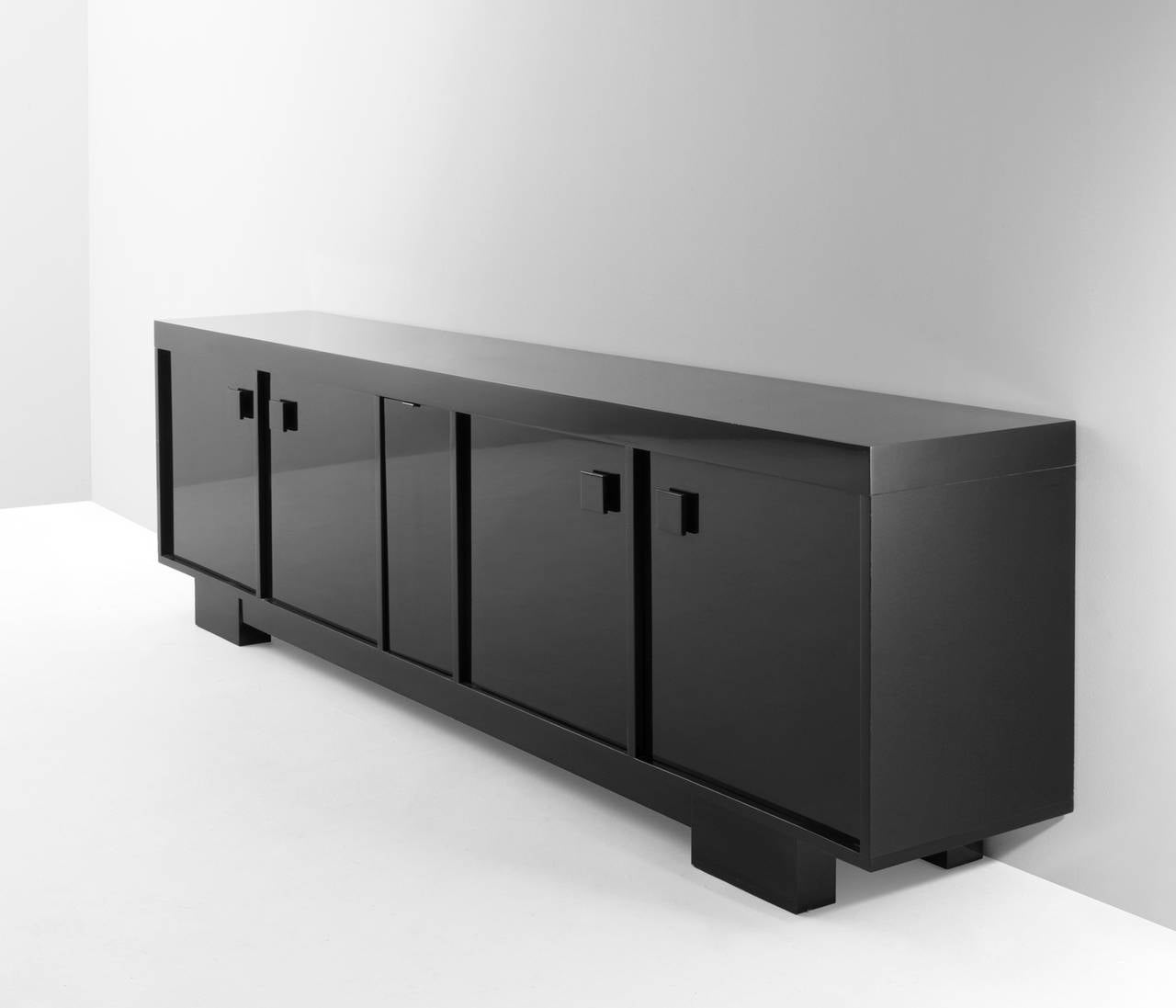A monumental, black high gloss sideboard consisting out of three separate modules, divided over five doors.

Veranneman, seen as Belgium's most influential and leading gallery owners and designers.

Free shipping for all European destinations