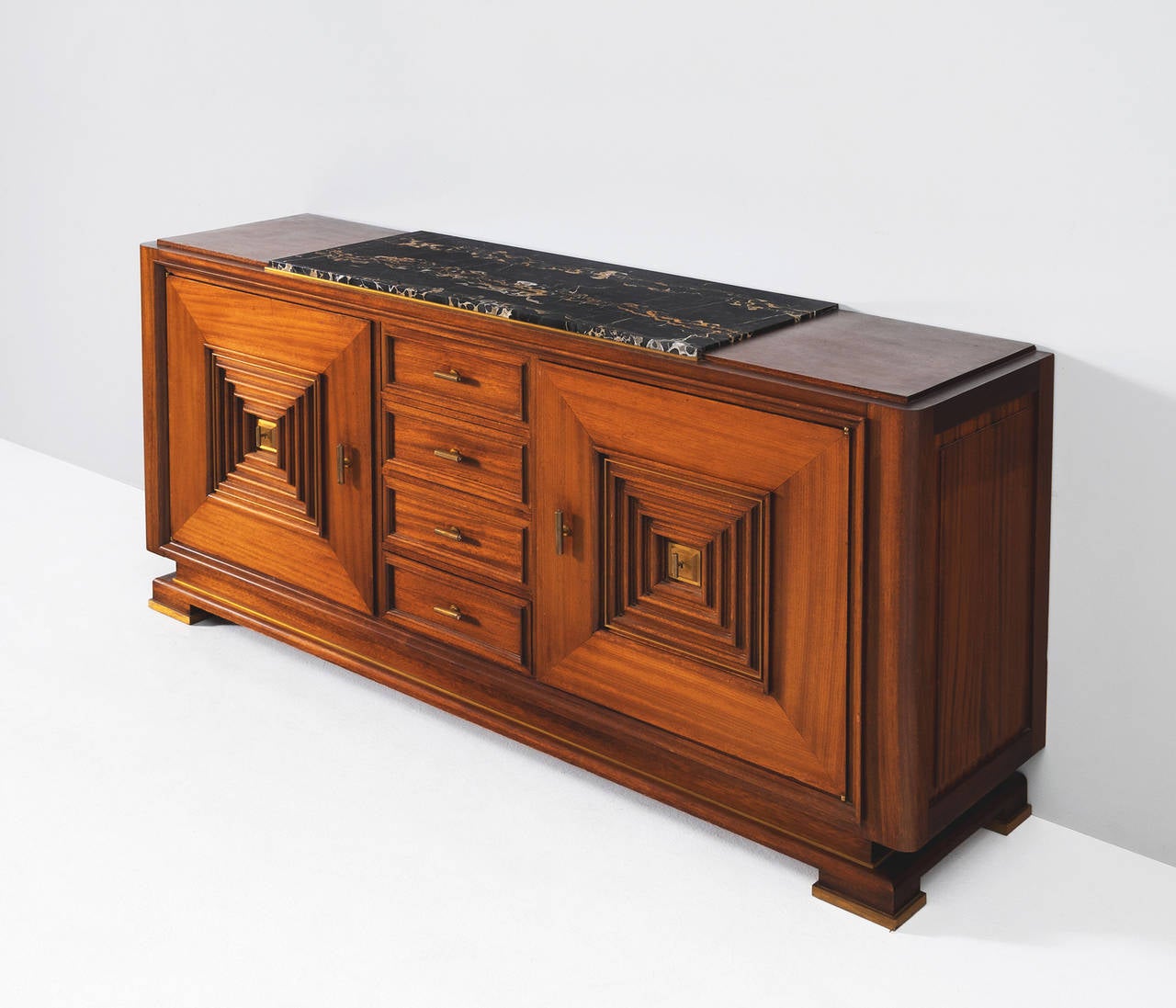 Credenza, in mahogany, walnut, marble and brass, France, 1930s. 

Large Art Deco sideboard in the style of Maxime Old. This heavy, almost Brutalist, credenza seems to float on its elegant base with stunning bronze detailing.

The credenza is