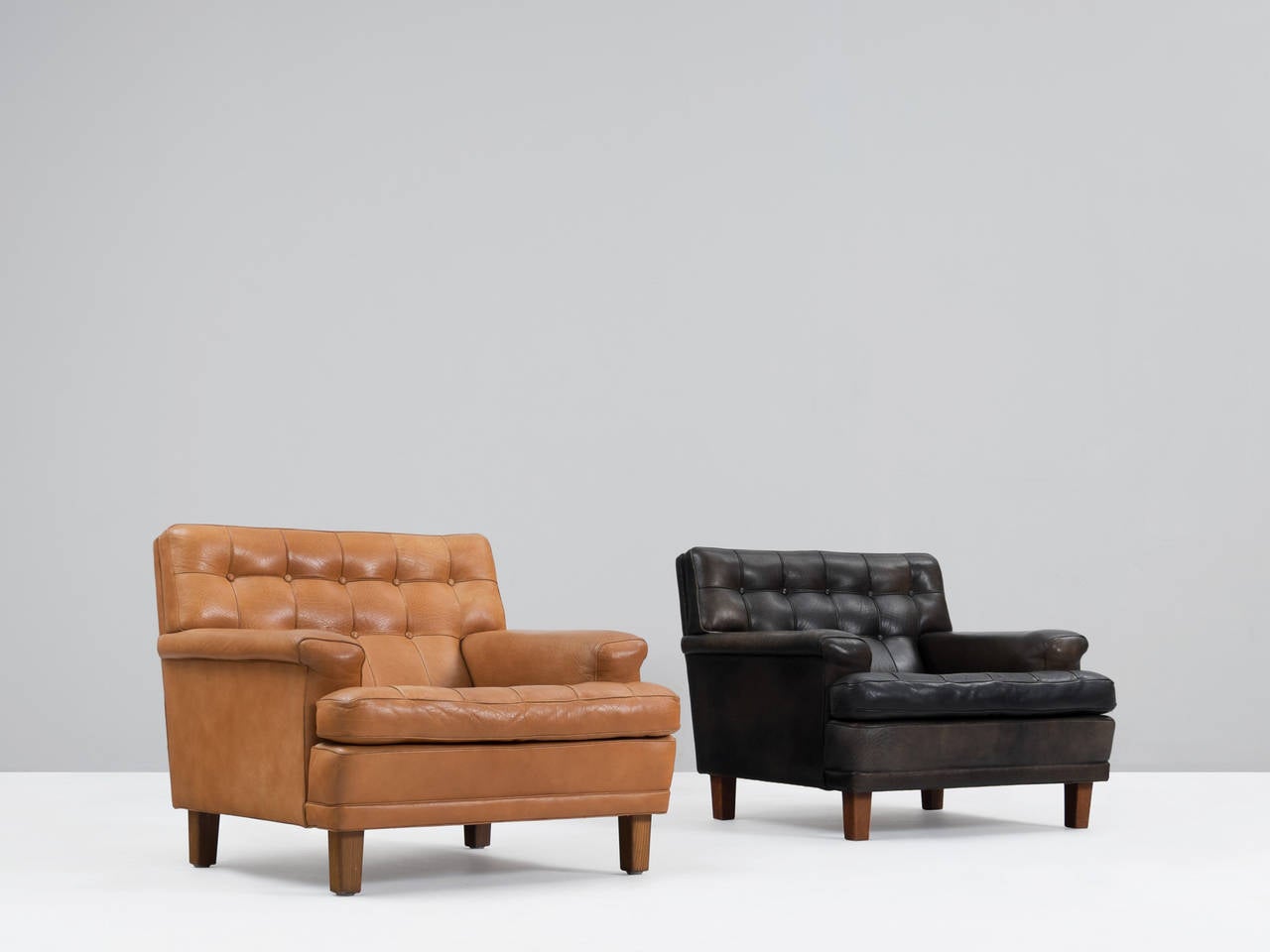 Swedish Arne Norell Pair of Easy Chairs in Black in Cognac Leather