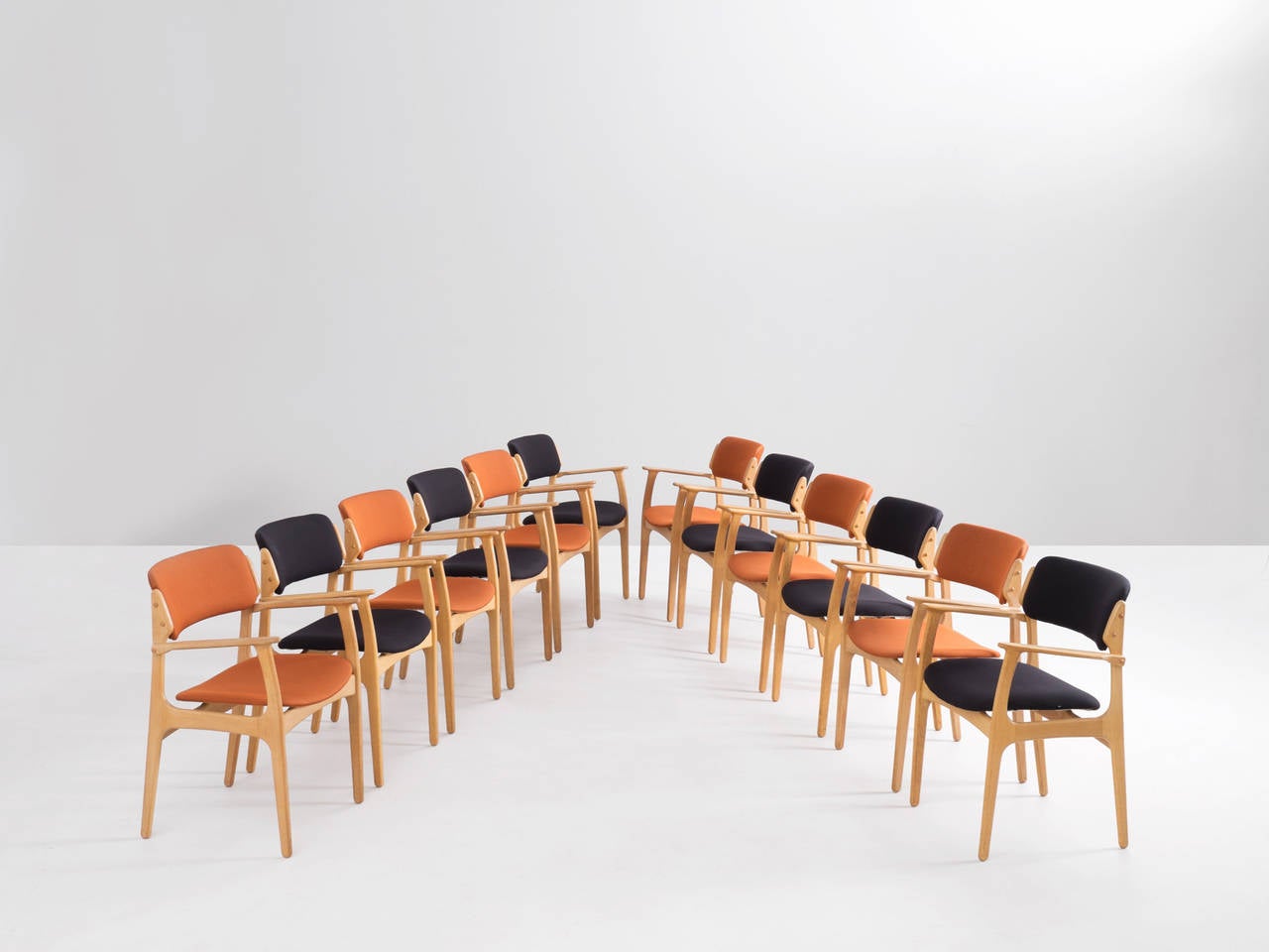 Large set of 12 dining chairs in oak wood by Erik Buck, Denmark, 1950s.

The chairs show elegant lines and stunning wood connections.
This set of ten, best known as 'model 50', are reupholstered in high quality fabric.

Solid construction with