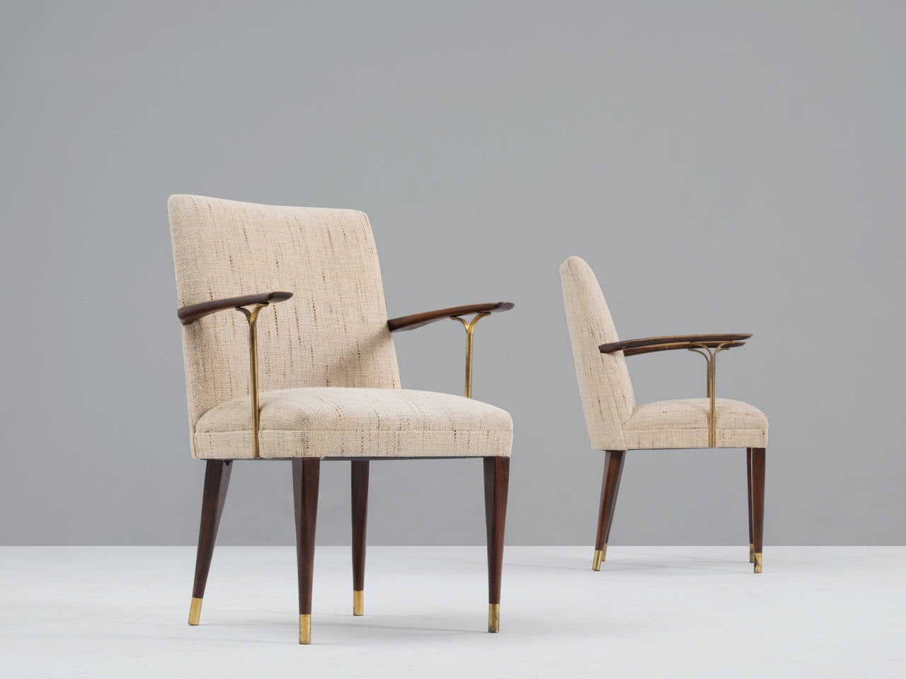 Set of six dining room chairs, in wood, brass and fabric, Italy, 1960s.

Set of six brass dining room chairs with wooden arms and brass details.
Very elegant shaped, great comfort. These chairs are still in their original fabric which is in quite