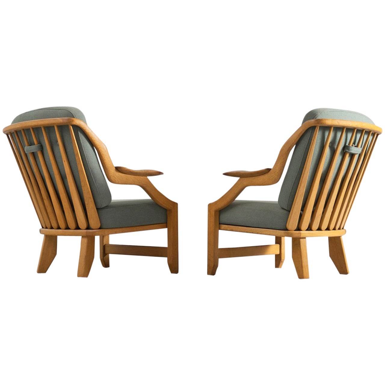 Pair of slat back lounge chairs by Guillerme & Chambron
