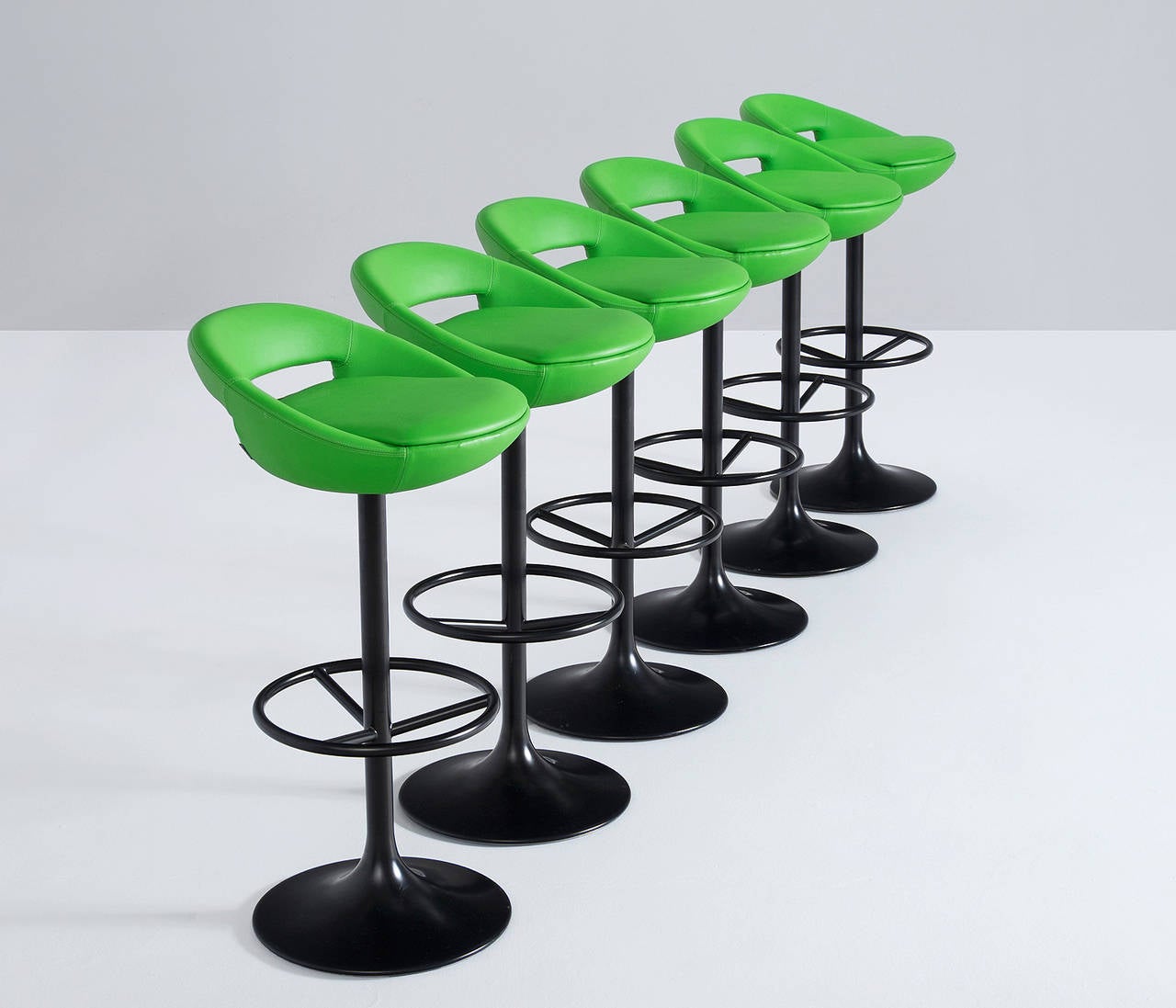Swedish modern swivel bar stools, 1970s.

Very comfortable, well made design. Original light green leather and black swivel base. Our in house upholstery team can upholster these in any required leather or fabric. 

More pieces (20+) available. Ask