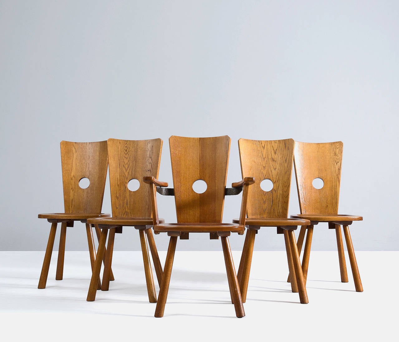 Set of five solid oak chairs from Dutch origin. This set consists of four chairs and one armchair.

The special thing about this chair is its unique shapes and proportions.
And of course it's high quality and excellent details.
