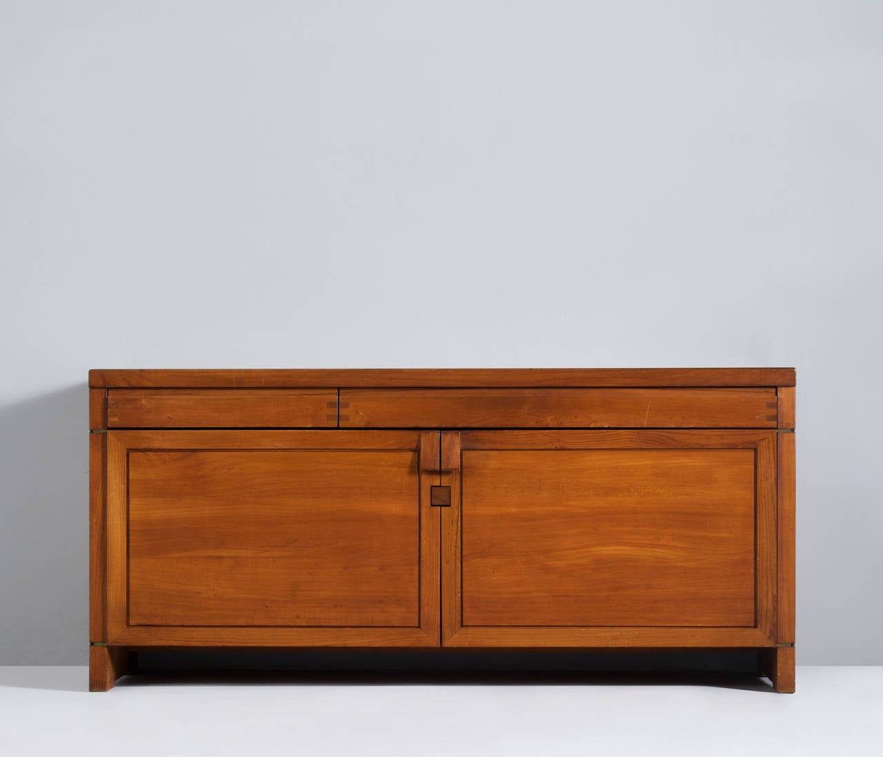Very rare sideboard Model R08 by Pierre Chapo, France 1960s.

This well crafted credenza shows the basic design and sincere construction details, which characterize Chapo's work. 
The frontal view is interesting, due to the well proportioned